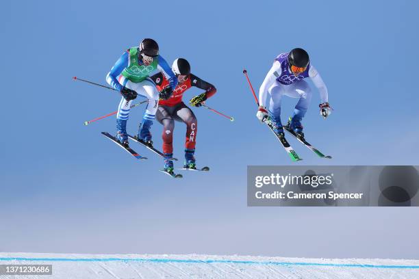 Francois Place of Team France, Jared Schmidt of Team Canada and Erik Mobaerg of Team Sweden compete during the Men's Ski Cross Quarterfinals on Day...