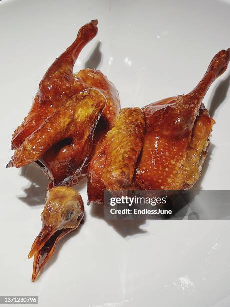 crispy pigeon - roast pigeon stock pictures, royalty-free photos & images