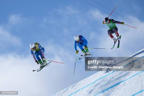 Sergey Ridzik of Team ROC, Simone Deromedis of Team Italy and Brady Leman of Team Canada compete during the Men's Ski Cross Semifinals on Day 14 of...