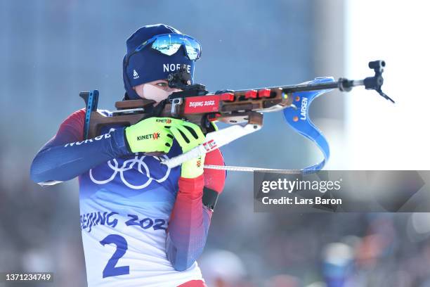 Marte Olsbu Roeiseland of Team Norway shoots during Women's Biathlon 12.5km Mass Start on day 14 of 2022 Beijing Winter Olympics at National Biathlon...