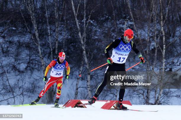 Roman Rees of Team Germany skis during Men's Biathlon 15km Mass Start on day 14 of 2022 Beijing Winter Olympics at National Biathlon Centre on...