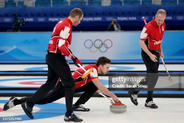 Geoff Walker, Brett Gallant and Mark Nichols of Team Canada compete against Team United States during the Men's Curling Bronze Medal Game on Day 14...