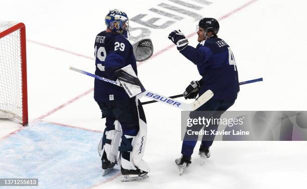 Harri Sateri and Mikko Lethonen of Team Finland celebrate the victory during the Men's Ice Hockey Playoff Semifinal match between Team Finland and...