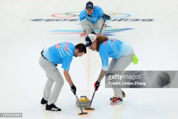 John Landsteiner, John Shuster and Matt Hamilton of Team United States compete against Team Canada during the Men's Curling Bronze Medal Game on Day...