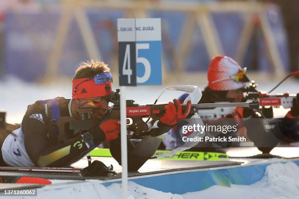 Roman Rees of Team Germany shoots during Men's Biathlon 15km Mass Start on day 14 of 2022 Beijing Winter Olympics at National Biathlon Centre on...