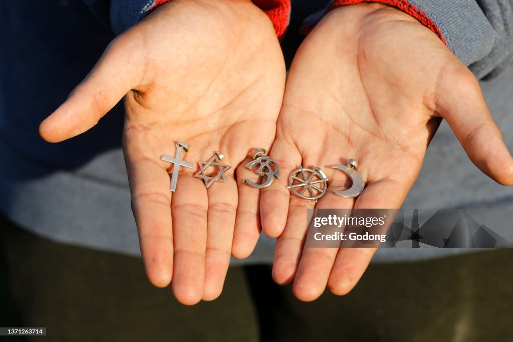 Boy's hand with religious symbols