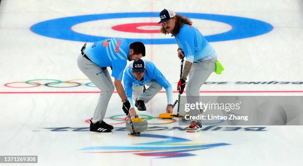 John Landsteiner, John Shuster and Matt Hamilton of Team United States compete against Team Canada during the Men's Curling Bronze Medal Game on Day...