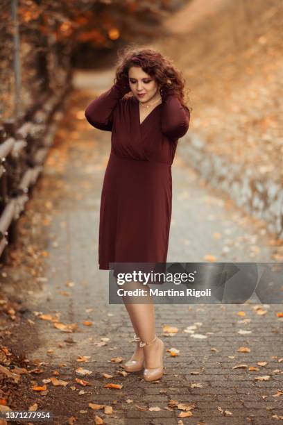 beautiful and elegant young woman portrait in autumn - maroon hair stock pictures, royalty-free photos & images