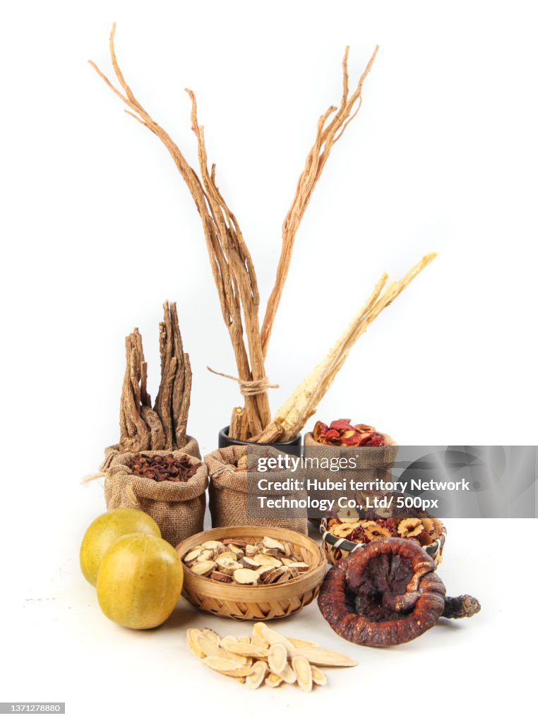 There is a mixture of traditional Chinese medicine on the white background
