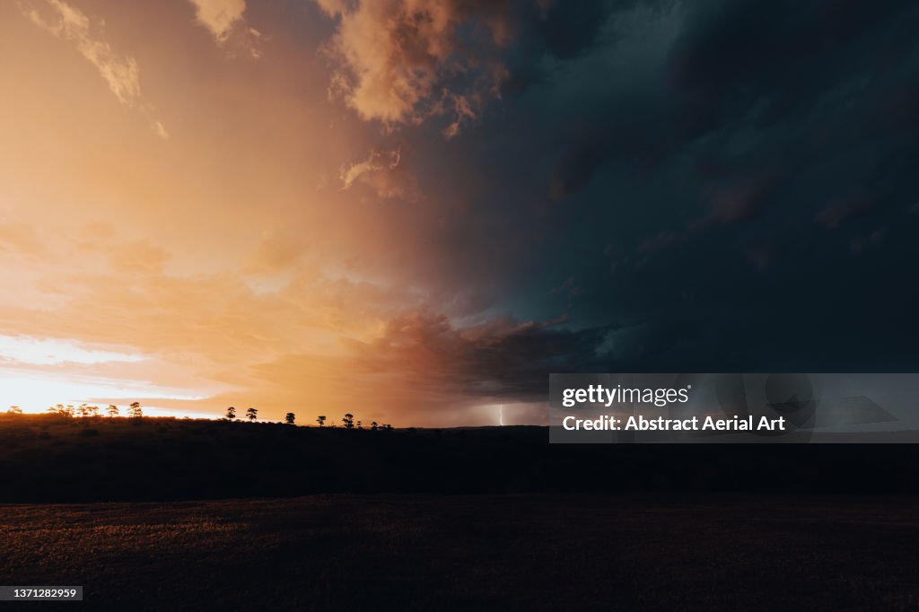 Distant lightning at sunset over the African bush, Eastern Cape, South Africa