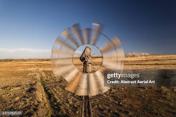 drone shot in front of a spinning weather station, free state, south africa - weather station stock pictures, royalty-free photos & images