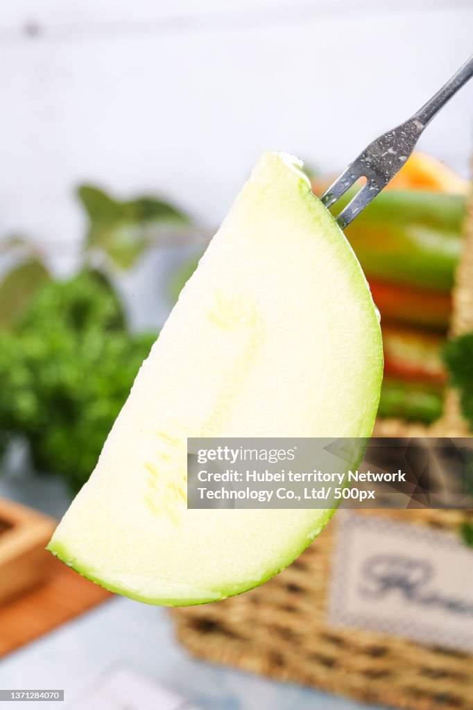 There are cut pumpkins on the board