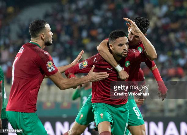 Celebrates scoring for Morocco with NAYEF AGUERD and ROMAIN SAÏSS during the Africa Cup of Nations 2021 round of 16 football match between Morocco...