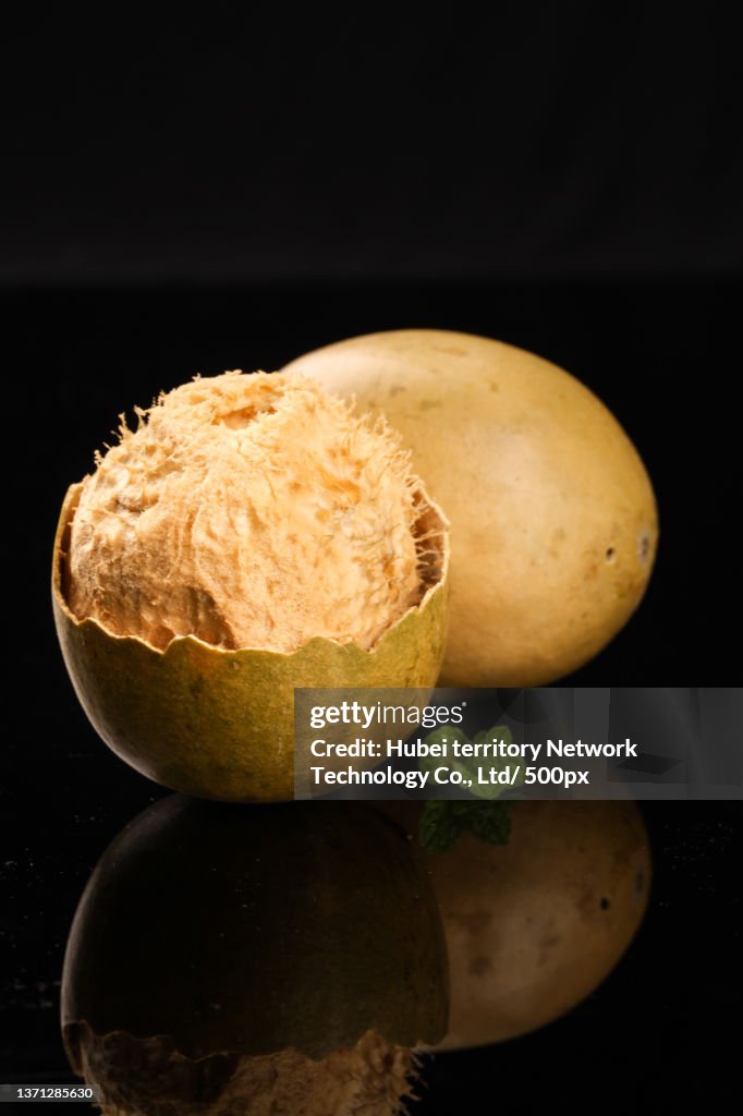 Put the peeled Siraitia grosvenorii on a black background