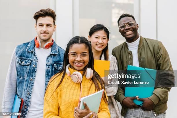 group of international young students standing outdoors - child standing stock pictures, royalty-free photos & images