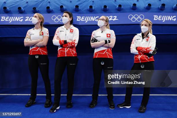 Melanie Barbezat, Esther Neuenschwander, Alina Paetz and Silvana Tirinzoni of Team Switzerland look on prior to competing against Team Japan during...