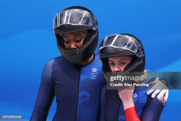 Mica Mcneill and Montell Douglas of Team Great Britain look on after sliding during the 2-women Bobsleigh heats on day 14 of Beijing 2022 Winter...