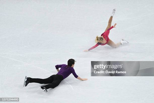 Kirsten Moore-Towers and Michael Marinaro of Team Canada fall during the Pair Skating Short Program on day fourteen of the Beijing 2022 Winter...