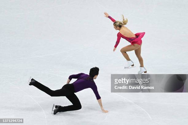 Kirsten Moore-Towers and Michael Marinaro of Team Canada fall during the Pair Skating Short Program on day fourteen of the Beijing 2022 Winter...