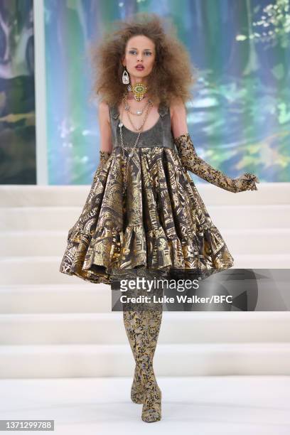 Model walks the runway at the Paul Costelloe show during London Fashion Week February 2022 on February 18, 2022 in London, England.