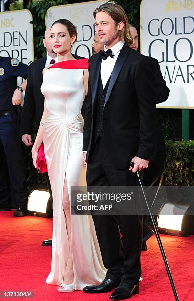 Actors Angelina Jolie and Brad Pitt arrive on the red carpet for the 69th annual Golden Globe Awards at the Beverly Hilton Hotel in Beverly Hills,...