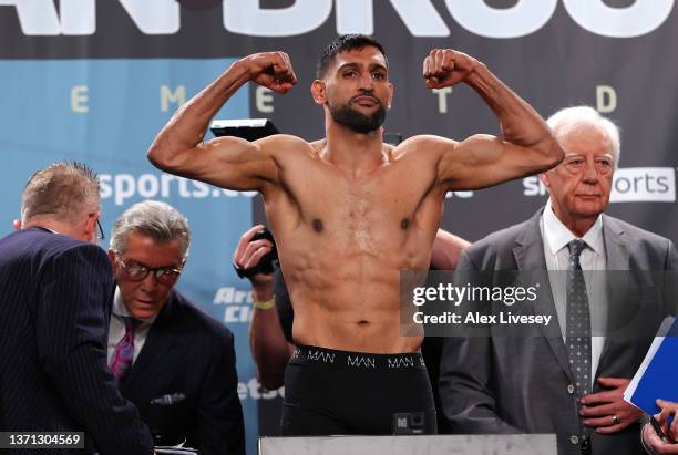 Amir Khan stands on the scales during the official weigh-in at Manchester Central Convention Complex ahead of his fight against Kell Brook on...