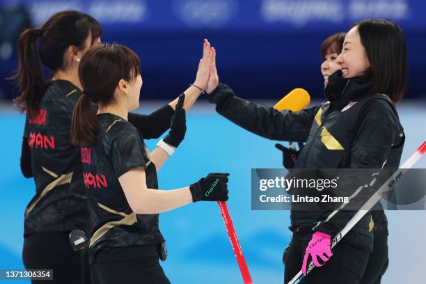 Yurika Yoshida, Yumi Suzuki, Chinami Yoshida and Satsuki Fujisawa of Team Japan interact while competing against Team Switzerland during the Women's...