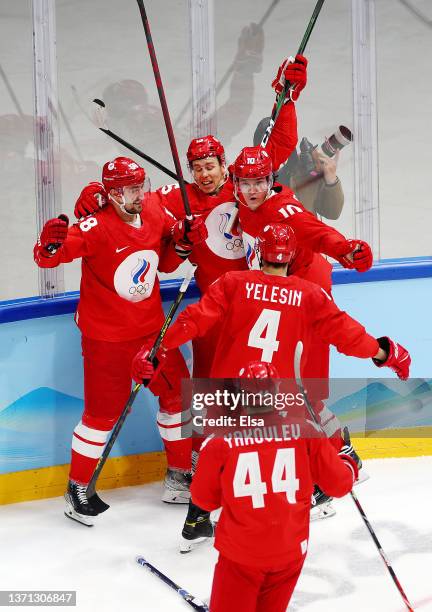 Anton Slepyshev of Team ROC celebrates a goal with his teammates in the second period during the Men's Ice Hockey Playoff Semifinal match between...