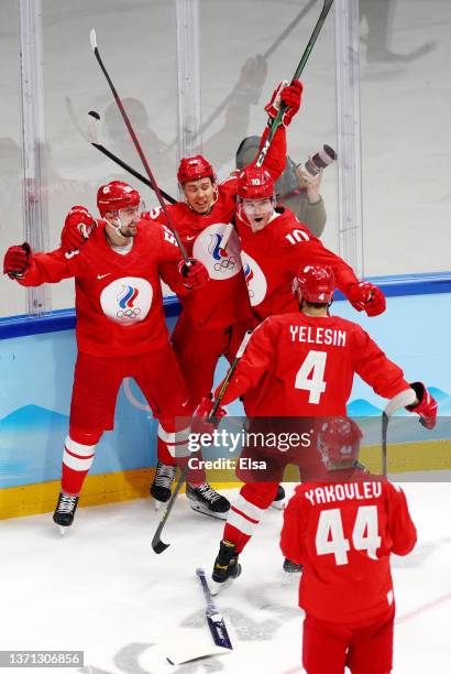 Anton Slepyshev of Team ROC celebrates a goal with his teammates in the second period during the Men's Ice Hockey Playoff Semifinal match between...