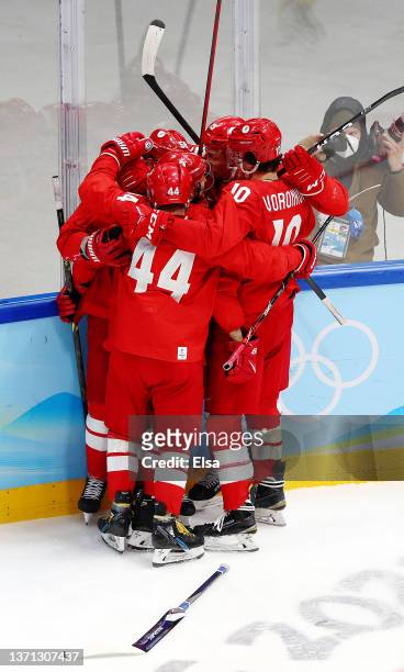 Anton Slepyshev of Team ROC celebrates a goal with his teammates in the second period during the Men's Ice Hockey Playoff Semifinal match between...