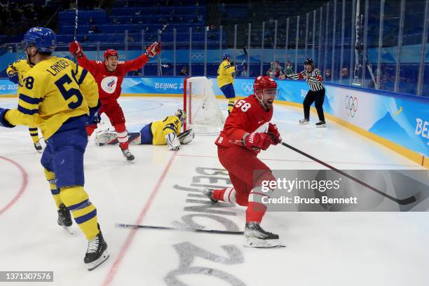 Anton Slepyshev of Team ROC celebrates after scoring a goal in the second period during the Men's Ice Hockey Playoff Semifinal match between Team ROC...