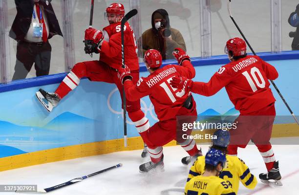 Anton Slepyshev of Team ROC celebrates goal with team in the second period during the Men's Ice Hockey Playoff Semifinal match between Team ROC and...