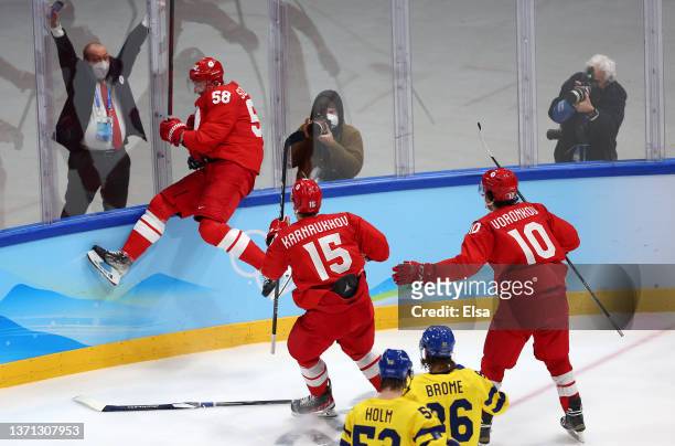 Anton Slepyshev of Team ROC celebrates goal with team in the second period during the Men's Ice Hockey Playoff Semifinal match between Team ROC and...
