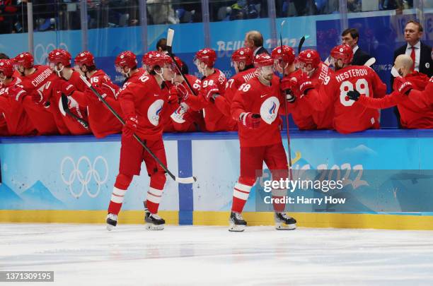 Anton Slepyshev of Team ROC celebrates a goal with their team in the second period during the Men's Ice Hockey Playoff Semifinal match between Team...