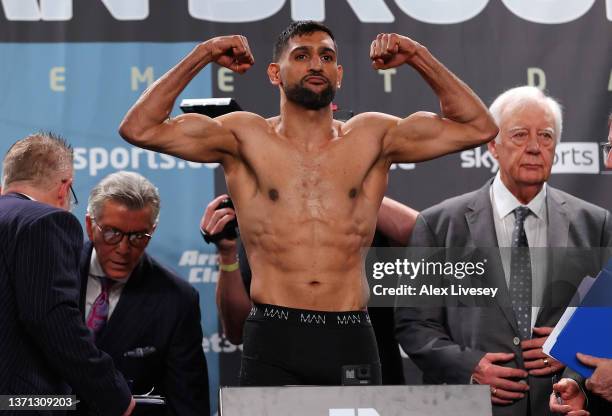 Amir Khan stands on the scales during the official weigh-in at Manchester Central Convention Complex ahead of his fight against Kell Brook on...