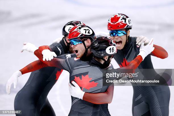 Team Canada with Charles Hamelin, Steven Dubois, Jordan Pierre-Gilles and Pascal Dion celebrate winning the Gold medal during the Men's 5000m Relay...
