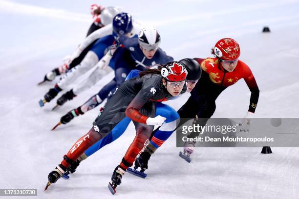 Courtney Sarault of Team Canada skates ahead of Yutong Han of Team China during the Women's 1500m Quarterfinals on day twelve of the Beijing 2022...