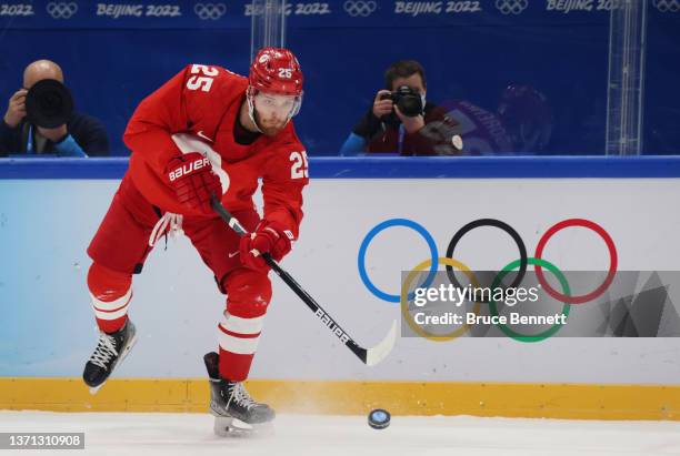 Mikhail Grigorenko of Team ROC skates with the puck in the second period during the Men's Ice Hockey Playoff Semifinal match between Team ROC and...