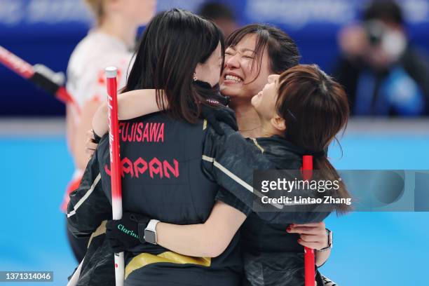 Yurika Yoshida, Satsuki Fujisawa, Chinami Yoshida and Yumi Suzuki of Team Japan celebrate their victory against Team Switzerland during the Women's...