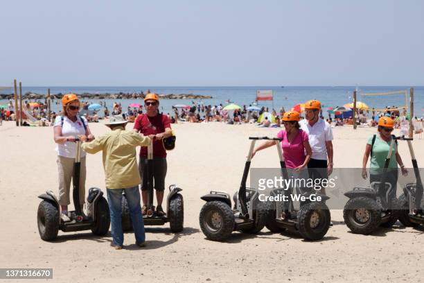 segway tour starting at gordon beach promenade in tel aviv - segway stockfoto's en -beelden