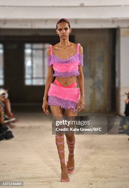 Model walks the runway at the Poster Girl show during London Fashion Week February 2022 on February 18, 2022 in London, England.
