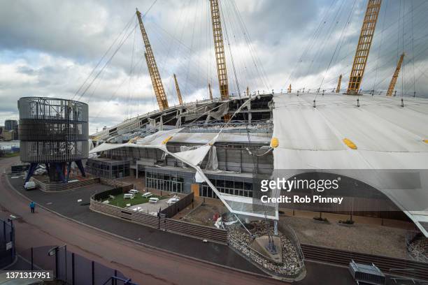 Damage is seen on the roof of the O2 Arena, formerly known as the Millennium Dome, on February 18, 2022 in London, England. The Met Office has issued...