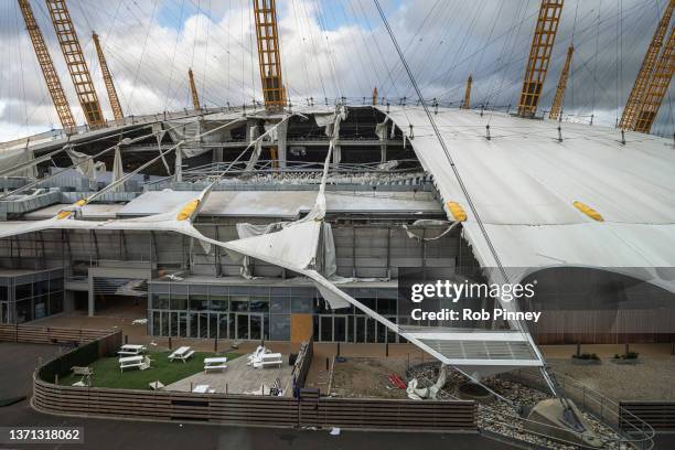 Damage is seen on the roof of the O2 Arena, formerly known as the Millennium Dome, on February 18, 2022 in London, England. The Met Office has issued...