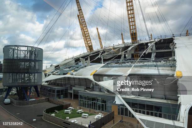 Damage is seen on the roof of the O2 Arena, formerly known as the Millennium Dome, on February 18, 2022 in London, England. The Met Office has issued...