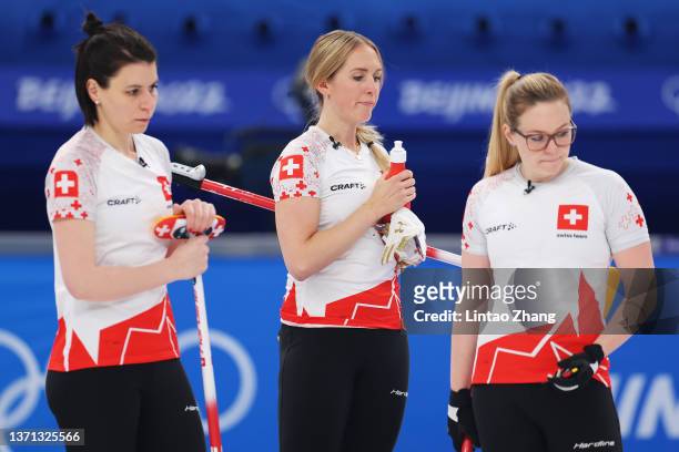 Esther Neuenschwander, Melanie Barbezat and Alina Paetz of Team Switzerland look on while competing against Team Japan during the Women's Semi-Final...