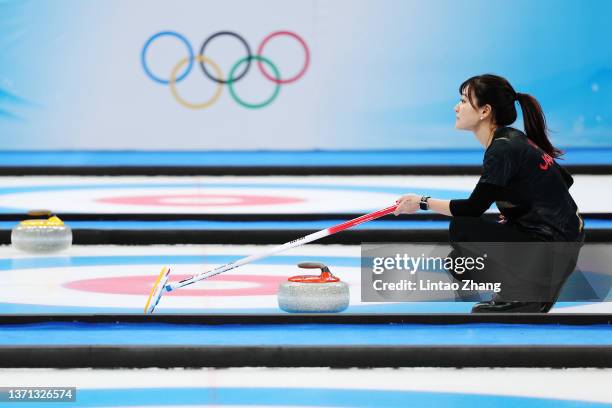 Chinami Yoshida of Team Japan competes against Team Switzerland during the Women's Semi-Final on Day 14 of the Beijing 2022 Winter Olympic Games at...