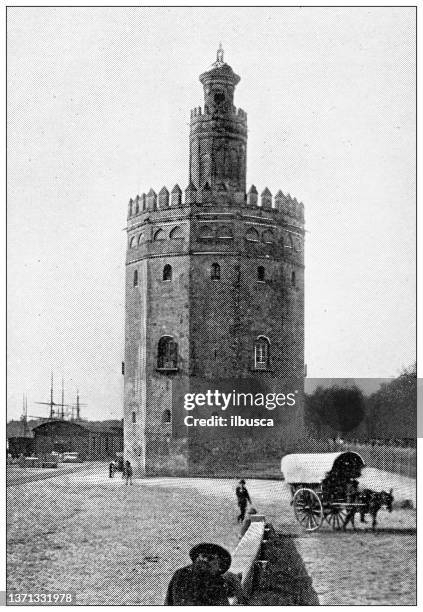 antique travel photographs of spain: seville, torre del oro - oro metal stock illustrations