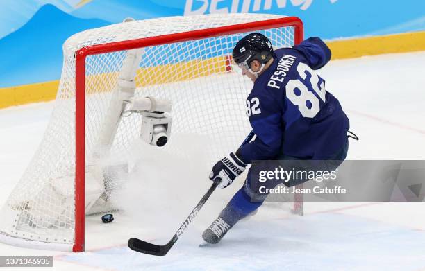 Harri Pesonen of Finland scores the second goal for his team in the last minute sending Finland to the Final during the Men's Ice Hockey Playoff...