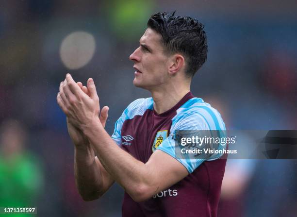 Ashley Westwood of Burnley applauds the fans after the Premier League match between Burnley and Liverpool at Turf Moor on February 13, 2022 in...