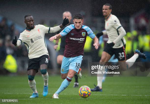 Ashley Westwood of Burnley in action with Naby Keita and Joel Matip of Liverpool during the Premier League match between Burnley and Liverpool at...